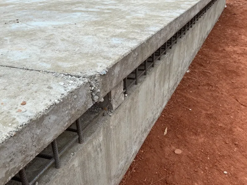 Barn pad with integrated drainage